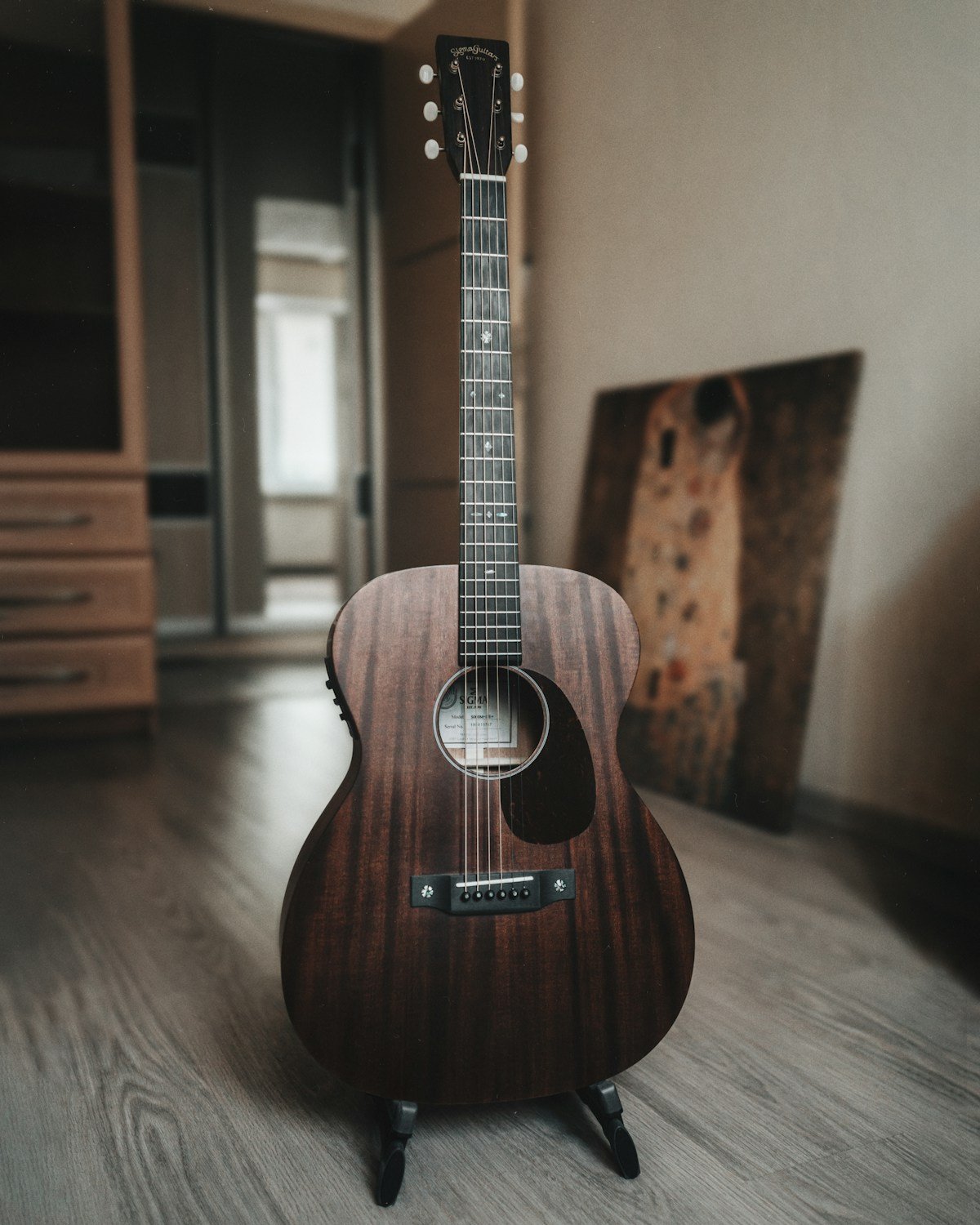 Sigma acoustic guitar in a natural wood finish
